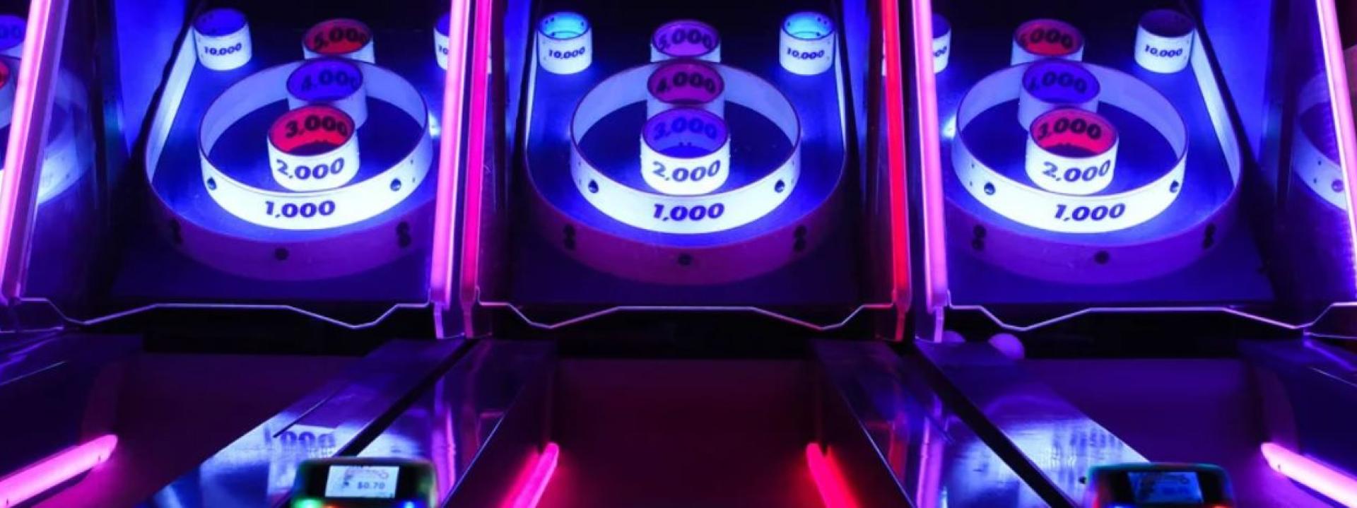 Photo of neon-lit arcade games
